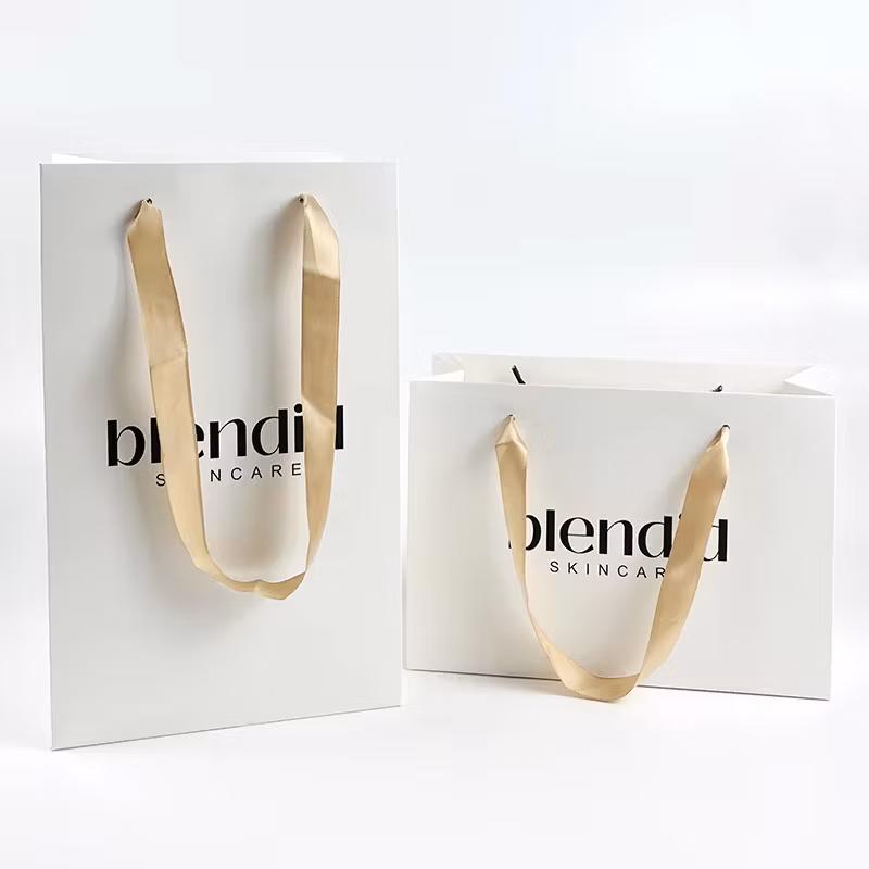 Custom Logo Printed Black Glossy Shopping Paper Bag Wholesale Luxury Retail Gift Craft Jewelry Cosmetic Packaging Paper Bags