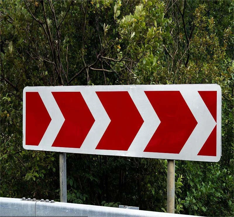 Red and White Arrow Traffic Direction Road Sign