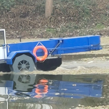 Fully Automatic Self-Retracting and Self-Unloading Lawn Mowing Boat